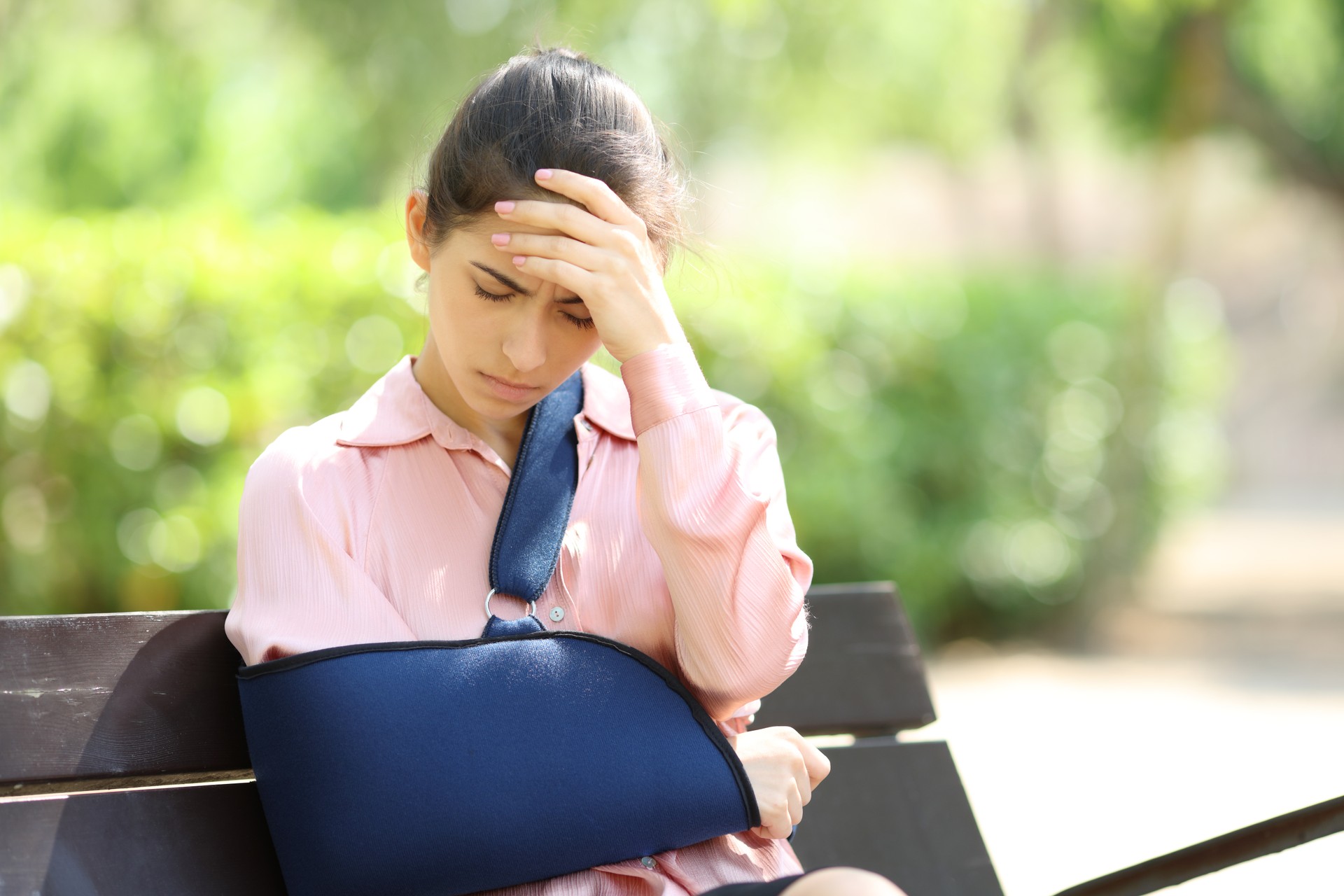 Worried convalescent woman in a park