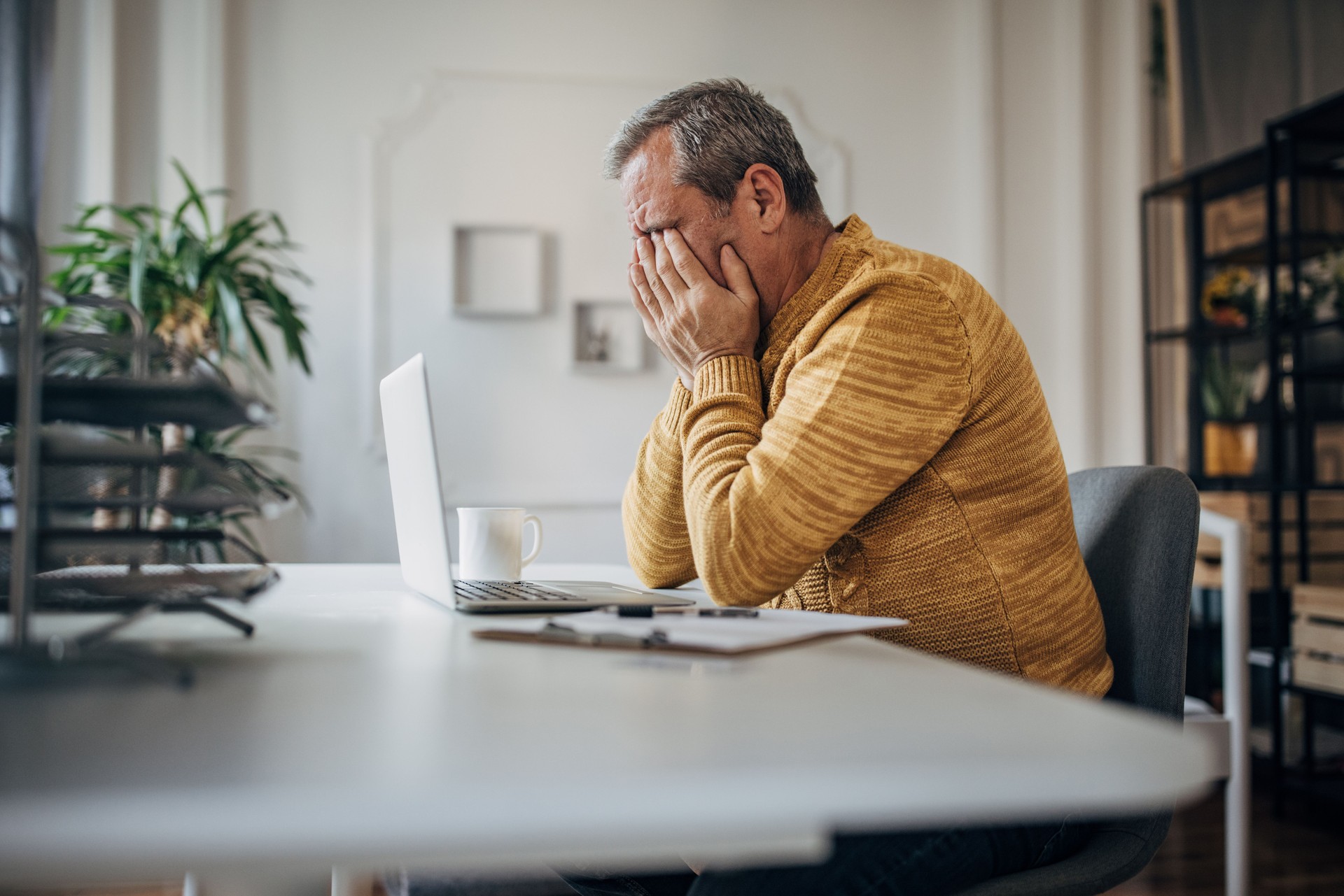 A man rests his eyes, work in the office