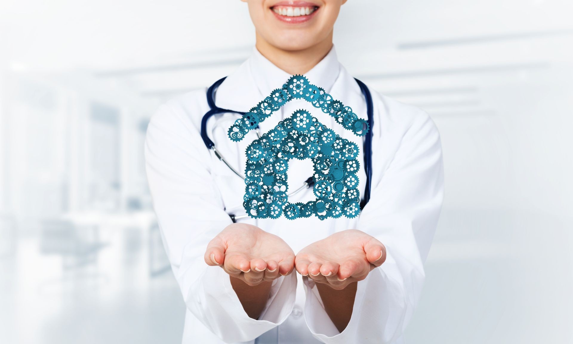 Hand of woman doctor showing house or home gear sign in palm